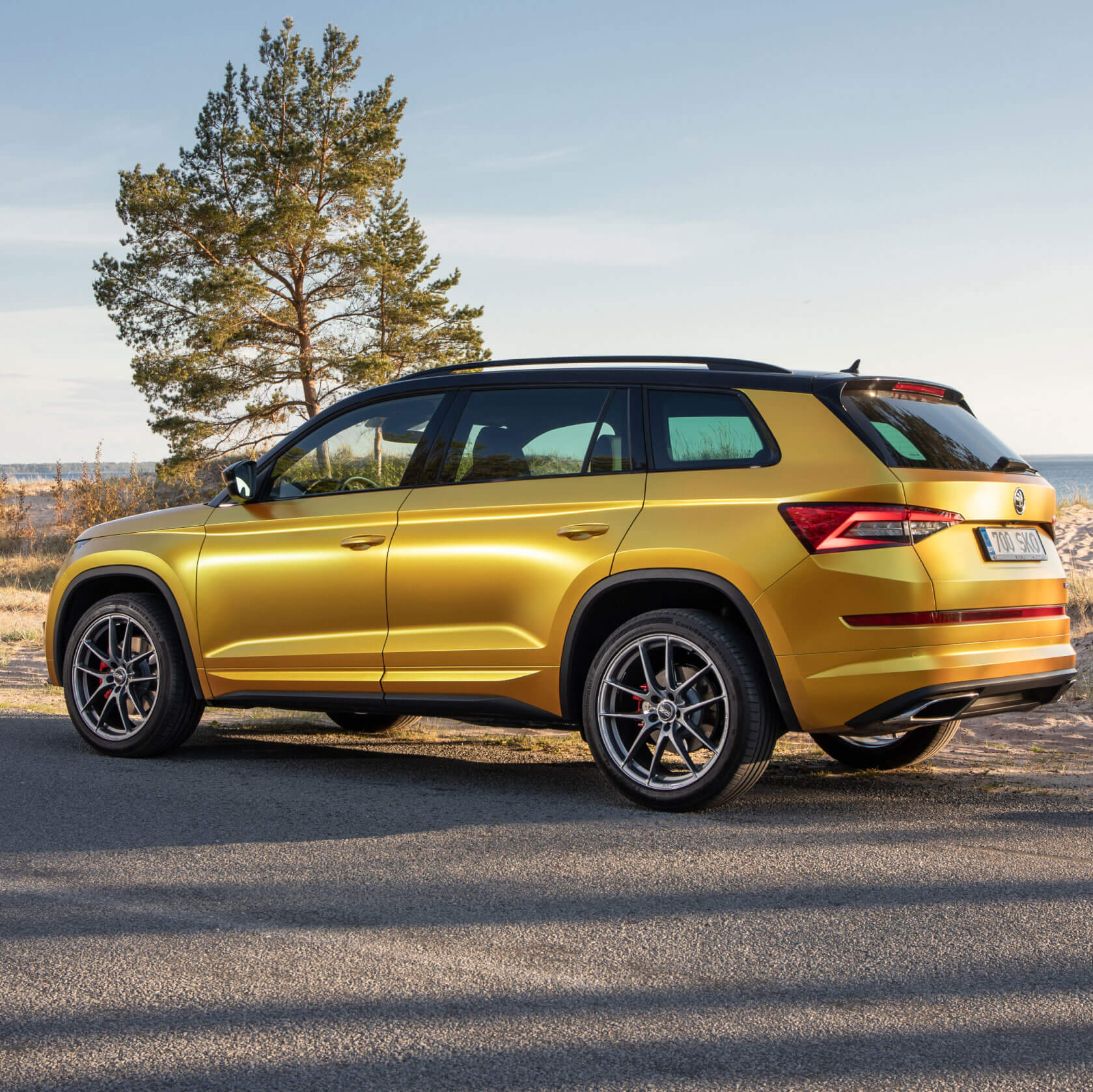 New car parked in front of a home